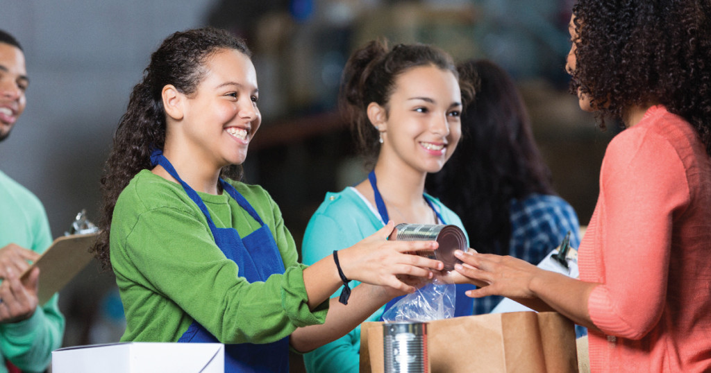 Girls handing out food